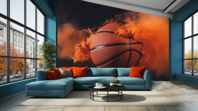 orange smoke reveals a basketball on a black background  Wall mural