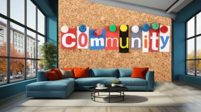 The word Community in magazine letters on a notice board Wall mural