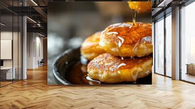 Close-up of hotteok filled pancakes oozing with syrup, text background on traditional desserts Wall mural