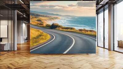 Picturesque coastal road with ocean views and rolling waves, capturing the essence of a scenic drive Wall mural