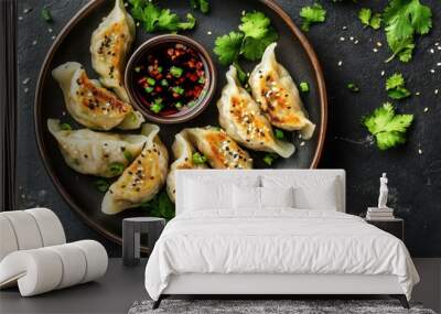 Top view of Korean vegetable dumplings (yachae mandu) with dipping sauce. Great for healthy meal ideas Wall mural