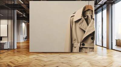 Trendy beige trench coat displayed against a neutral background. Plenty of copy space on the left side Wall mural