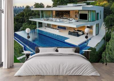 A modern mansion, with an infinity pool made of white and blue mosaic tiles, surrounded by lush greenery, overlooking the city skyline.  Wall mural