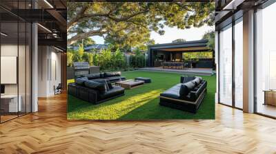 A stunning modern black and wood garden with lush green grass, featuring outdoor seating perfect for socializing in the backyard of an architecturally designed home Wall mural