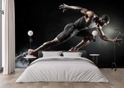 The athlete is in the position of sprinting from a starting point with maximum speed. Wall mural