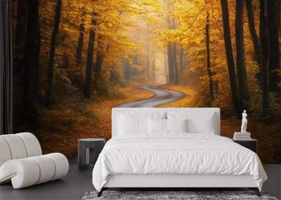 Eastern European autumn forest with a winding road, vibrant yellow and orange leaves, and majestic tree trunks creating a magical and serene atmosphere Wall mural