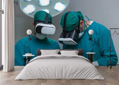 Doctor surgeon wearing virtual reality glasses. The surgeon is doing surgery by inserting a camera and using a VR controller. Wall mural