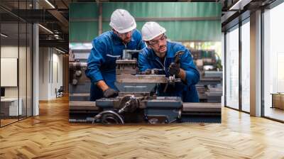 Engineers and skilled technicians are maintaining machinery. Engineers are working and repairing machines in industrial. Technician holding Measuring pliers. Scale Metal Vernier caliper measuring. Wall mural