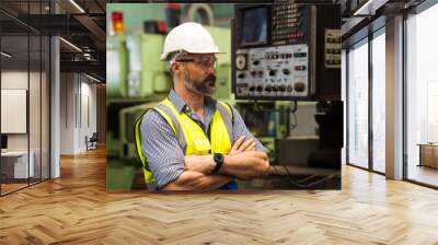 handsome technician worker at manufactorying. caucasian middle aged engineer manager wearing uniform Wall mural