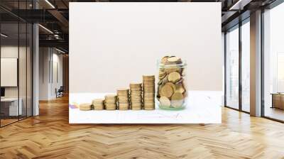 business concept for financial and banking with coin stack and coins in glass to saving and investment. Wall mural