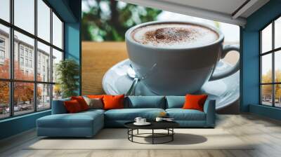 closeup coffee cup on wood table bar in restaurant or cafe with copy space. fresh beverage. Wall mural