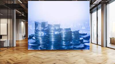 row of coin stack with double exposure night city background for financial banking and saving money and business stock investment concept. Wall mural