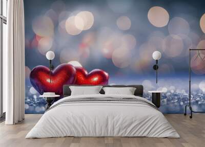 Two red hearts on sparkling surface with bokeh lights in the background Wall mural