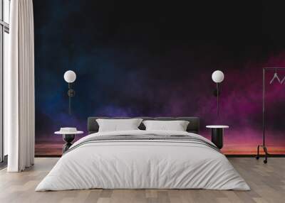 empty wooden table with colorful smoke float up on dark background Wall mural