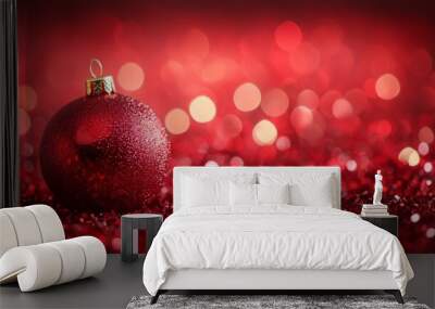 lose-up of red Christmas ornaments on a pine branch with glittery bokeh lights in a warm festive luxury background. Wall mural