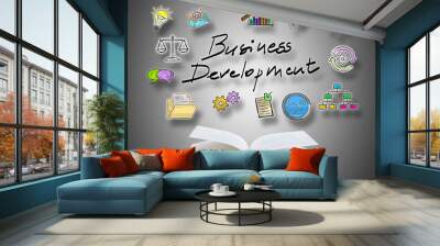 Business development concept above a book Wall mural