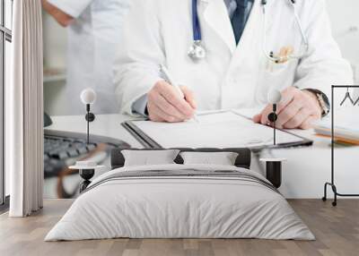 doctor signing a medical report Wall mural