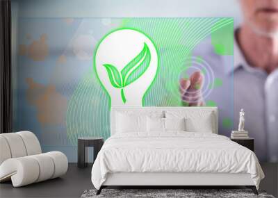 Man touching a green energy concept Wall mural