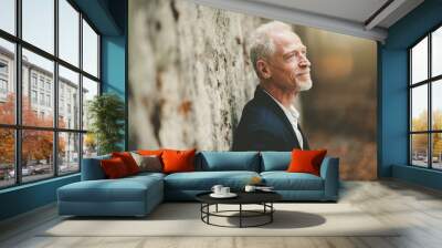 Portrait of handsome mature man, light effect Wall mural