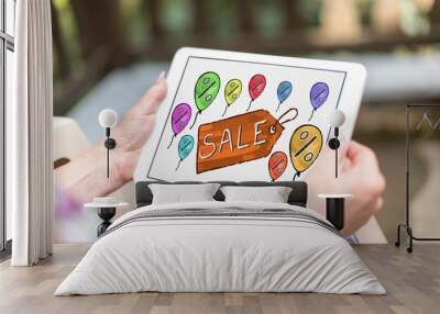 Sale concept on a tablet Wall mural