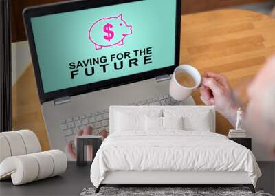 Saving for the future concept on a laptop Wall mural