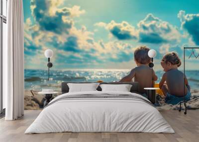 Two young children playing with beach toys by the ocean shore Wall mural