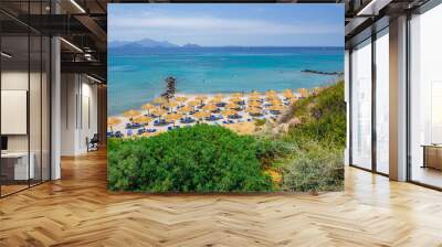 Beaches, Greece, Kos Island, Cap Helona: beautiful holiday setting on a secluded beach with umbrellas on the Greek Aegean Sea with turquoise waters and a picturesque bay and islands in the background Wall mural