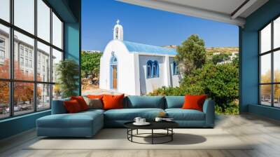 Beautiful white blue greek church situated in the streets of Lipsi at the mediterranean sea sourrounded by beautiful landscape and magical bays, Arki Island, Patmos, Dodecanese, Greece Wall mural