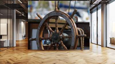 Steering wheel of an old boat Wall mural