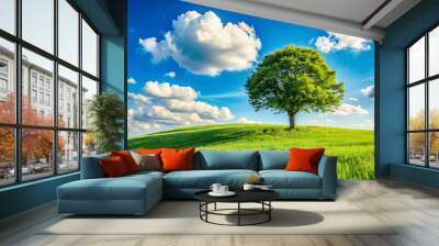 A single tree stands on a grassy hill under a clear blue sky and clouds natural background, solitude zen relax tree isolated various design Wall mural