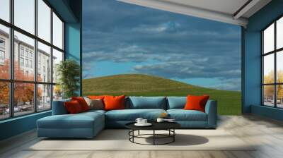 two different shapes of green in a landscape with sky Wall mural