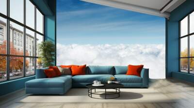 above the cumuls clouds, blue sky background Wall mural