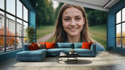 Close portrait of a smiling young Belarusian woman looking at the camera, Belarusian outdoors blurred background Wall mural