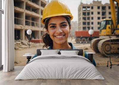 Close portrait of a smiling young Egyptian woman construction worker looking at the camera, Egyptian outdoors construction site blurred background Wall mural