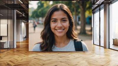 Close portrait of a smiling young Salvadoran woman looking at the camera, Salvadoran outdoors blurred background Wall mural