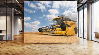 close view of modern combine harvester in action. Wall mural