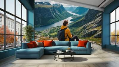 Woman traveler hiking in Norway girl backpacker relaxing on mountain cliff edge, Wall mural