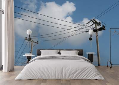 Electrical pole with many cable under blue sky. at Thailand. Wall mural