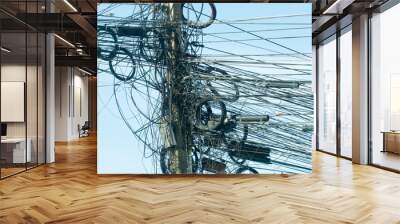 Various types of wires that are messy on the power pole. Wall mural