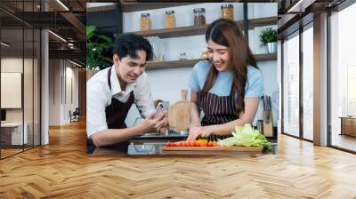 asian couple cooking at kitchen Wall mural