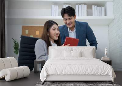 asian couple working at office Wall mural