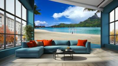 Beautiful turquoise lagoon of Bora Bora and the overwater bungalows of a luxury resort Wall mural