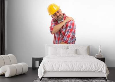 Constructor touching painful shoulder. Wall mural