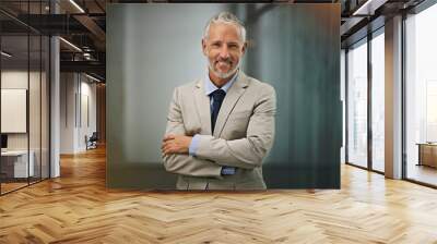 Portrait, confident and arms crossed with a business man in his office, looking happy about his company growth. Mission, mindset and vision with a senior male corporate manager standing at work Wall mural