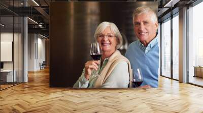 We enjoy a little wine tasting every now and again. Cropped portrait of an affectionate senior couple wine tasting in a cellar. Wall mural