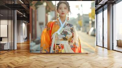 A Korean model in a fusion hanbok, showcasing a blend of traditional and modern fashion elements. The scene is set in a trendy urban environment, Wall mural