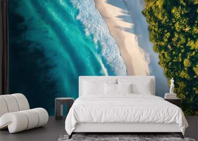 A drone shot of a pristine coastline with turquoise ocean water and white sand beaches. Wall mural