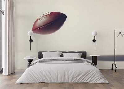 Football floating above a white surface, creating a subtle shadow below Wall mural