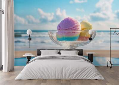 A glass bowl of colorful ice cream scoops on the beach. Wall mural