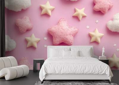 A pink and white star and cloud pattern on a pink background. Wall mural